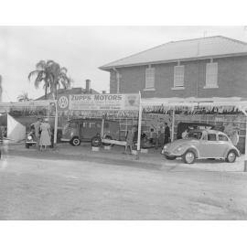 Staff and show-goers at the Zupps Motors Ipswich Show display, Ipswich, 1958