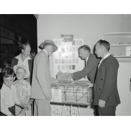 Staff of Ipswich Building Suppliers with customers at their display, Ipswich Show, Ipswich, 1958