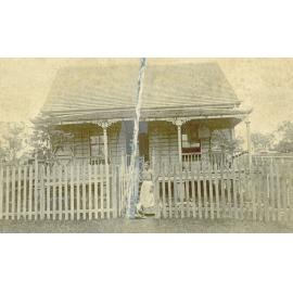 Mother with children in front of house, corner of Wildey and Cascade Streets, Raceview, Ipswich, c.1912