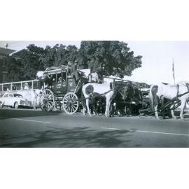 Cobb & Co re-enactment coach in front of Ipswich North State School, North Ipswich, 1950s