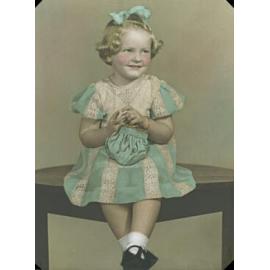 Portrait of a young girl in a lace and cotton dress, Ipswich, 1947