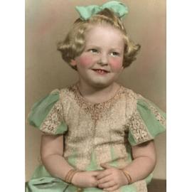 Portrait of a young girl in a lace and cotton dress, Ipswich, 1947