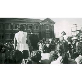 Spectators outside Ipswich North State School watching parade, North Ipswich, 1950s