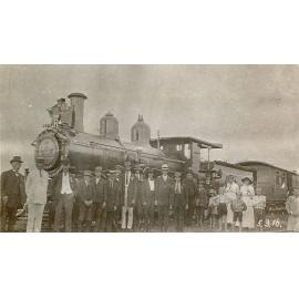 Staff and friends from Railway Workshops, North Ipswich, in front of picnic train, 1916