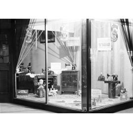 Window display of Singer sewing machines, including toy machines, Ipswich, 1930s