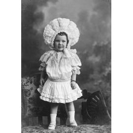Young  child, in elaborate clothing, Ipswich, 1896-1905