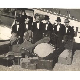 Members of Nitelites Band in front of Dragon Moth plane that took them to Jandowae, Archerfield, Brisbane