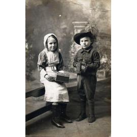 Two children dressed up to collect funds for the war effort during World War I, c.1915