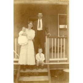 William and Lizzie Bere with their two sons on veranda of home at 9 Weldon Street, North Ipswich, 1922