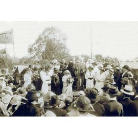 Jean Gilson presented with a bouquet of flowers by the Governor of Queensland, Goodna, Ipswich, 1918