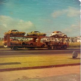 Road transport carrying cars to saloon car titles, Eastern Heights, Ipswich, 1970s