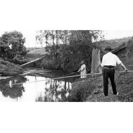 Florence and William  Castle fishing beside the Bremer River, Ipswich, c.1920