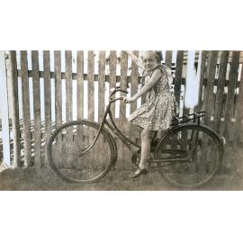 Melva Richards of Booval on her Whippet bicycle, Ipswich, 1949