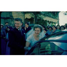 Wedding party in front of Uniting Church manse, Ellenborough Street, Ipswich, 1954