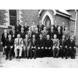 Group of men in front of Uniting Church, Ipswich, 1940s