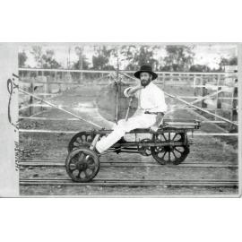 Unidentified rail worker on a rail hand cart (velocipede), Ipswich, c.1900