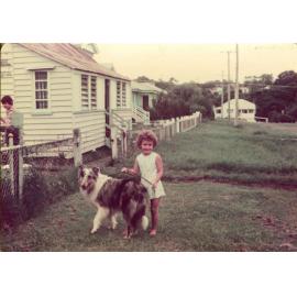 Young girl with dog in front of home in England Street, East Ipswich, 1943
