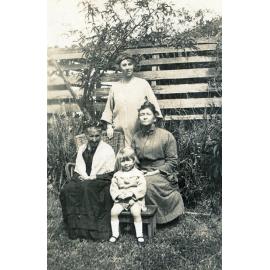 Family group in garden, North Ipswich, 1920s