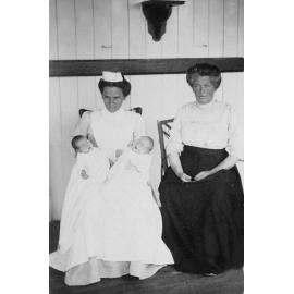Nurse Linning, holding twin boys of Mrs P McInally, Marburg, 1912