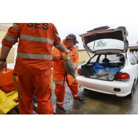 SES volunteers loading sandbags into a car, SES Depot, Ipswich, January 2013