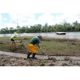 Cleaning up after flooding at Colleges Crossing, January 2013