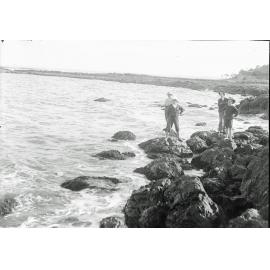 Unidentified group of boys fishing on rocks at Woody Point, Redcliffe, c.1900's