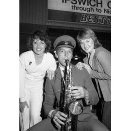 Ladies with saxophonist from the Ipswich Vice-Regal Model Band at the Ipswich Colour Festival, Ipswich, August 1980