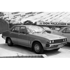 Sigma car at Don Faulkner Motors car yard, Ipswich, September 1981