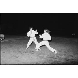 Two unidentified men practicing karate wearing traditional gi, Ipswich, October 1980