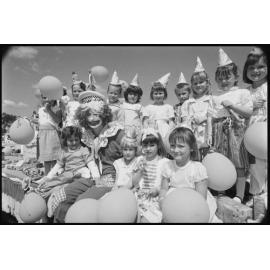 Unidentified children with a clown on a parade float at the Laidley Spring Festival, Laidley, Lockyer Valley, September 1987