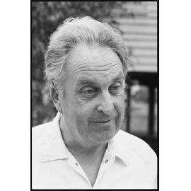 Unidentified man outside timber building, Ipswich, September 1987