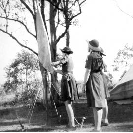 Hoisting the flag during the Mavis Parkinson Shield competition, Brassall, Ipswich, 1960