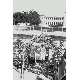 Muriel Johnson in the front of  'Cremona' at 83 Chermside Road, East Ipswich, c.1920
