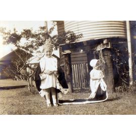 Shirley and Claire Evans playing 'dress ups'  at Goodna, Ipswich, 1935