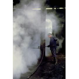 Steam cleaning locomotive at the Ipswich Railway Workshops Roundhouse, North Ipswich, 1969