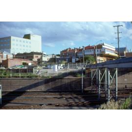 View of buildings on Brisbane Street, from railway lines, Ipswich, 1985