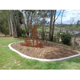 Historical Silhouette of two Aboriginal men in a canoe at Kholo Gardens, 2022