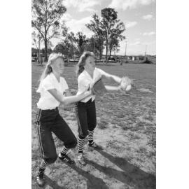 Unidentified Bombers Softball Club players practicing in a park, Ipswich, Queensland, January 1978