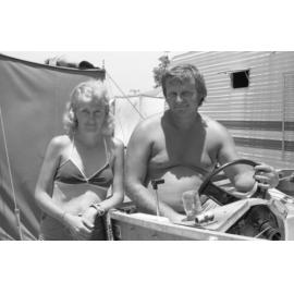 Unidentified couple, thought to be from Ipswich, with boat on holiday, Queensland, January 1978