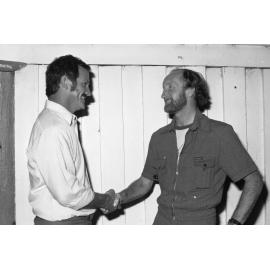 Unidentified men shaking hands, Ipswich, December 1977