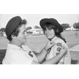 Unidentified woman badging a Girl Guide, Ipswich, December 1977