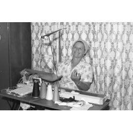 Unidentified woman with knitting machine, Ipswich, Queensland, January 1978