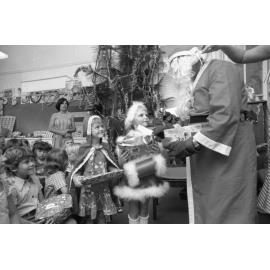 Santa Claus handing out presents, Ipswich, December 1977