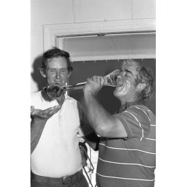 Golf players drinking beer out of a yard glass, Ipswich, December 1977