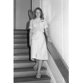 Reid's Department Store model in drawstring blouse and front slit skirt, Ipswich, January 1978