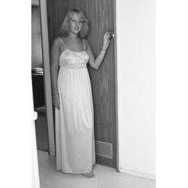 Reid's Department Store model in smocked satin nightdress, Ipswich, January 1978