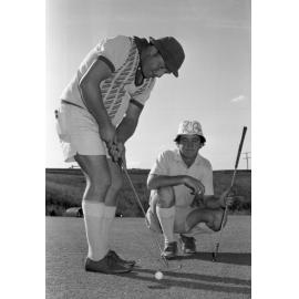 Two golfers at a golf course, Ipswich, Queensland, January 1978
