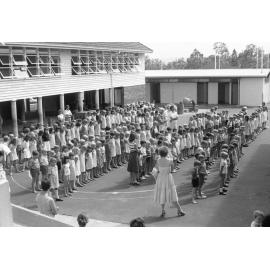 School children standing at assembly, Ipswich, Queensland, January 1978