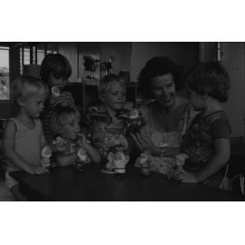 Woman playing with children at at the Grandchester State School centenary celebration, Grandchester, Ipswich, January 1978