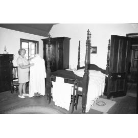 Mrs Wass touring a bedroom inside Wolston House, Wacol, Queensland, January 1978